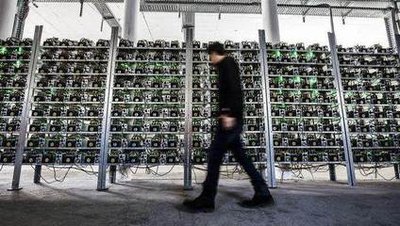 A large-scale cryptocurrency mining farm with rows of Ethereum mining rigs