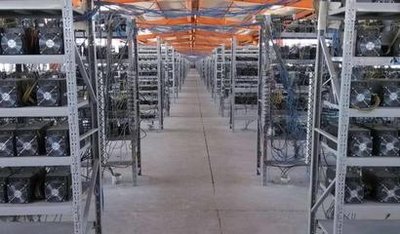 Large mining farm with rows of hosted mining rigs